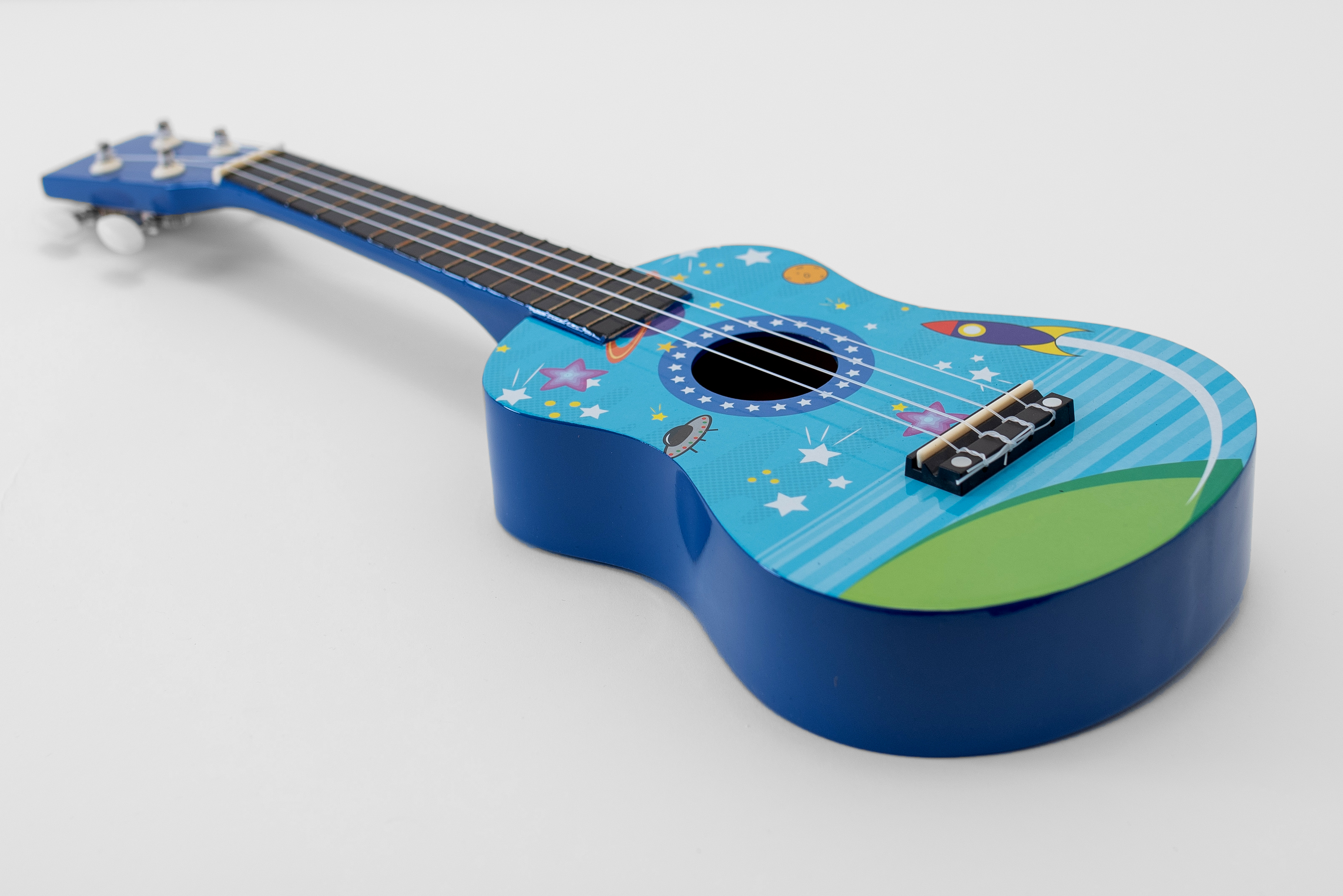 Ukulele sopranowe Rakiety Pokrowiec Struny Kostki Stroik Akordy ZESTAW