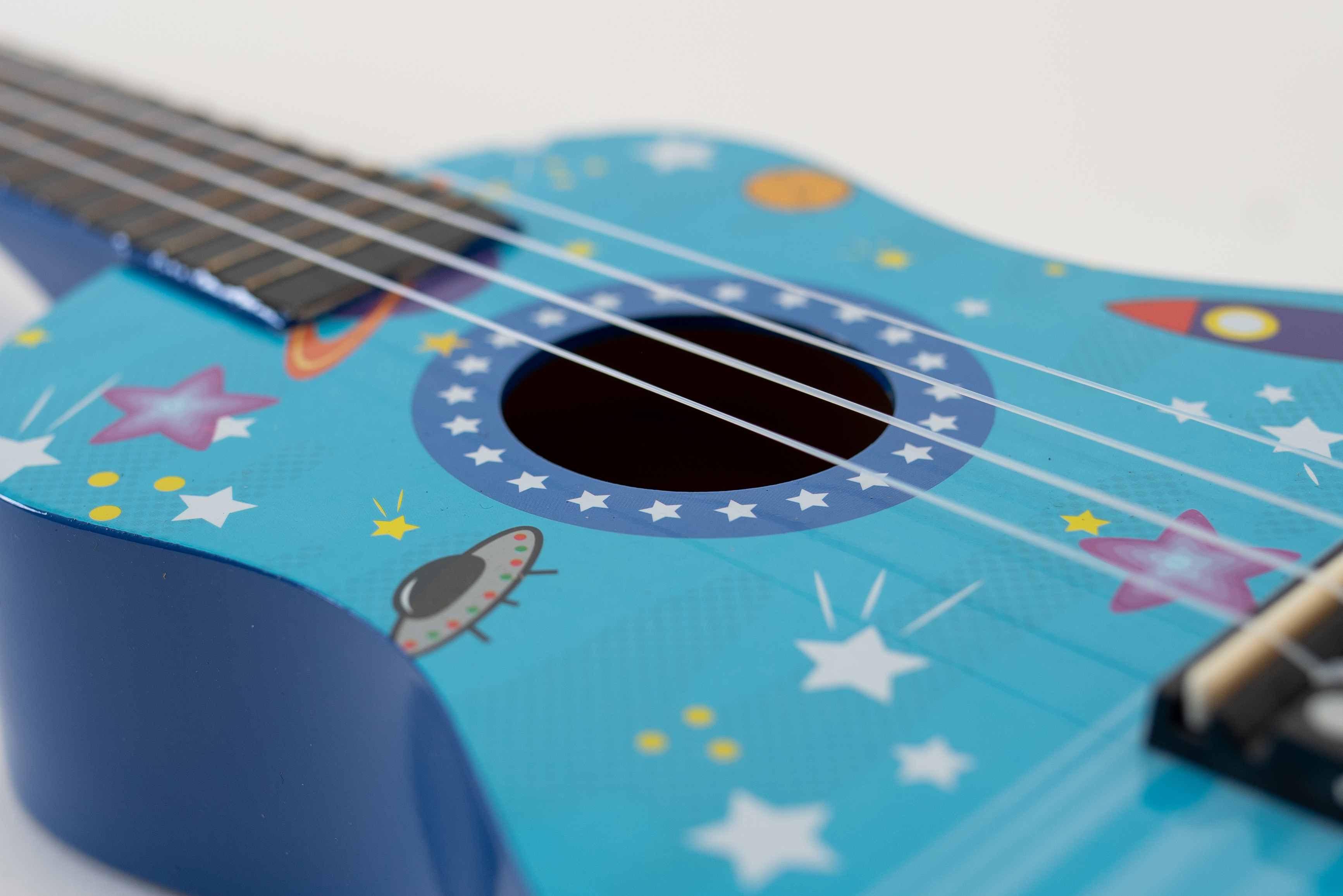 Ukulele sopranowe Rakiety Pokrowiec Struny Kostki Stroik Akordy ZESTAW